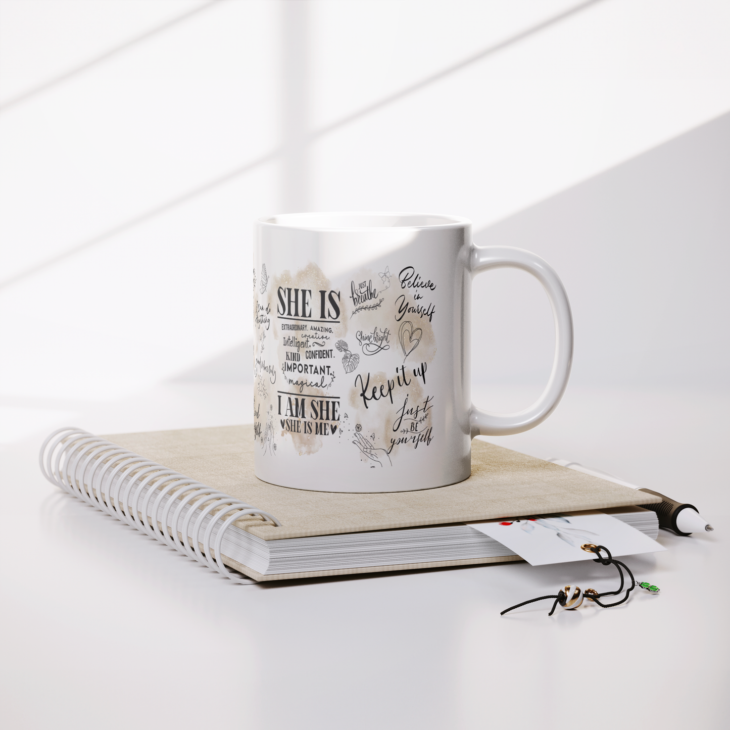 She_Is_Affirmation_Mug__11oz_Ceramic__Lifestyle_Notebook_Mockup.png
