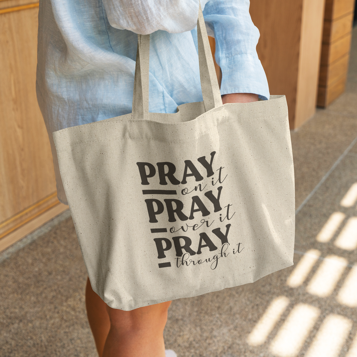 Pray_On_It_Pray_Over_It_Pray_Through_It__CottonTote_L_WomanDigging_Mockup.png